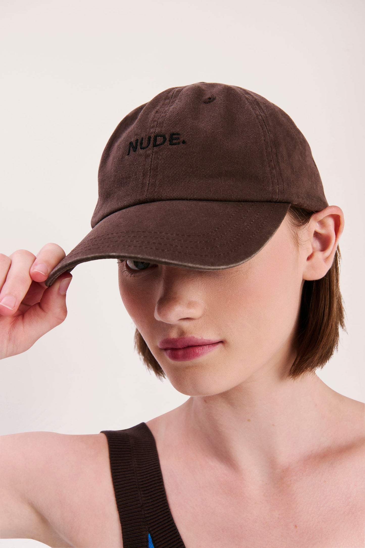 NUDE. CAP
